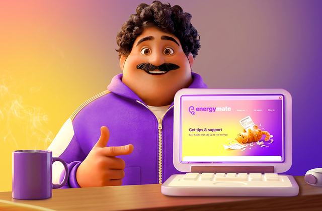 Colin sitting at his desk pointing at the Tips page on his laptop